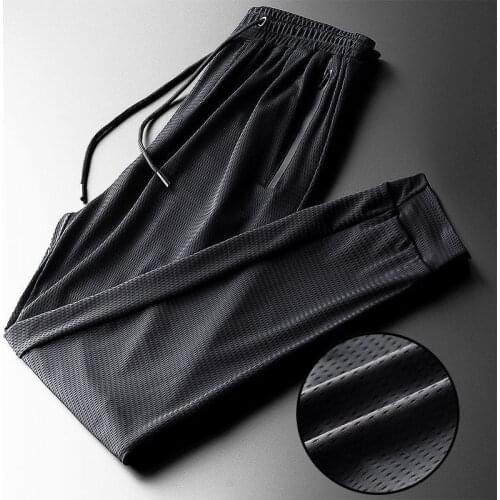 Summer ice silk casual pants mens ultra-thin loose sports pants quick-drying plus size small feet nine-point pants tie-pants
