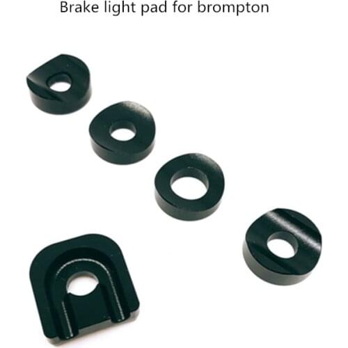 Bicycle brake light U-shield for brompton brakes and lamp holder