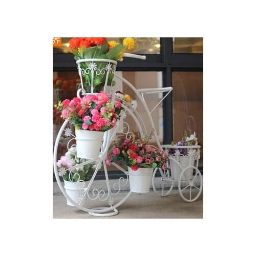 Bicycle florist. Wrought iron layers The balcony floor cosmetic