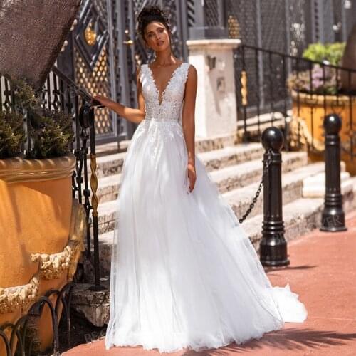 KapokDressy Boho Beach Wedding Dresses Lace Appliqued V-neck Backless Bridal Dress Tull Princess Wedding Gowns Plus Size