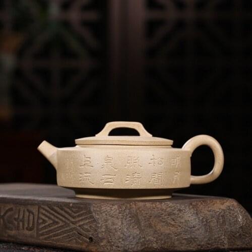 Yixing manufacturer wholesale custom undressed ore sesame mud beautifully carved paint with the ball hole wall