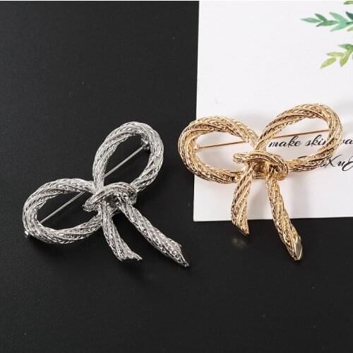 High-end twisted twisted noodle bow brooch womens party big-name high-quality metal brooch gift jewelry 2020 new