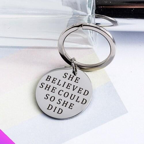 Keychain stainless steel disc pendant engraved with "she believed she could so she did