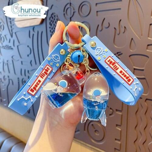 Creative Keychain Cartoon Astronaut Into The Oil Key Chain Planet Pendant Floating Car Key Chain Bag Key Chain Hanging Jewelry