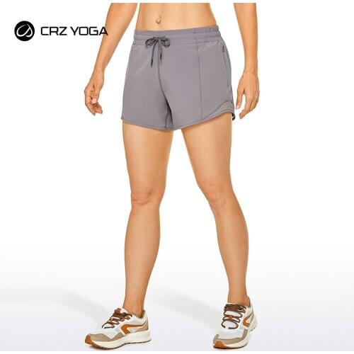 CRZ YOGA Womens Quick Dry Lightweight Stretch Athletic Sports Shorts with Zipper Pockets - 4 inches