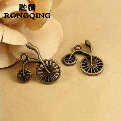 RONGQING 50pcs/lot 25*23MM Hollow Bicycle Charms Bronze Physical Transportation Metal Charms Vintage