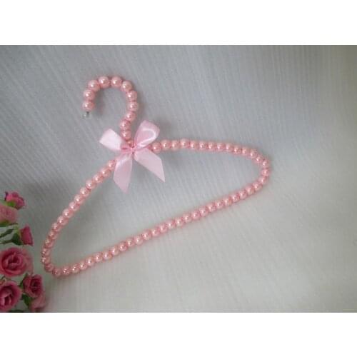 2017 Rushed Promotion Prateleira Wall Shelf Pearl Meniscus Bowknot Children Dress Clothes Hanger Abs Plastic Wholesale Beads