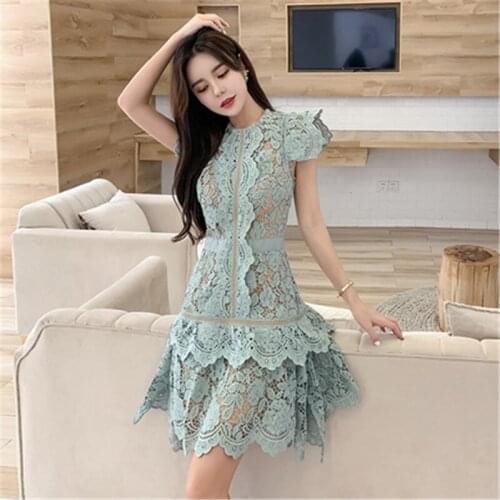 Lace irregular dress 2020 summer new womens heavy industry lace hollow flying flying sleeve sexy slim solid color dress