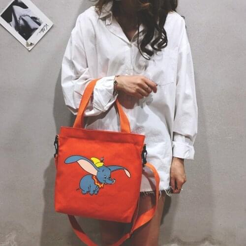 Disneys new Dumbo female casual canvas shoulder bag student portable messenger school bag tutoring bag lady shopping storage ba