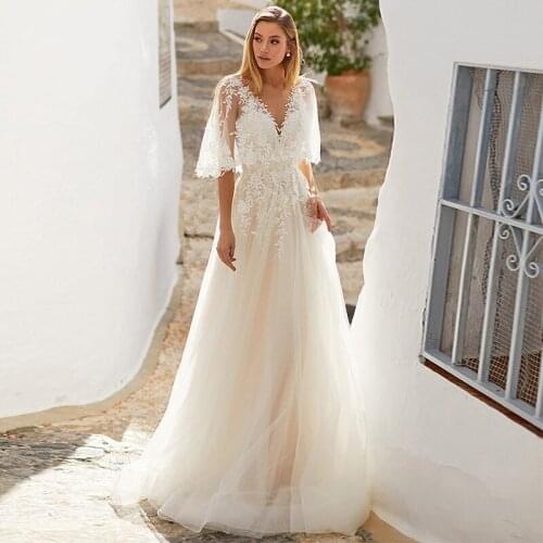 Floor Length Lace Appliques Sweep Train Long Sleeve V-Neck Wedding Dress Backless Backless Bridal Gowns Stunning High Quality