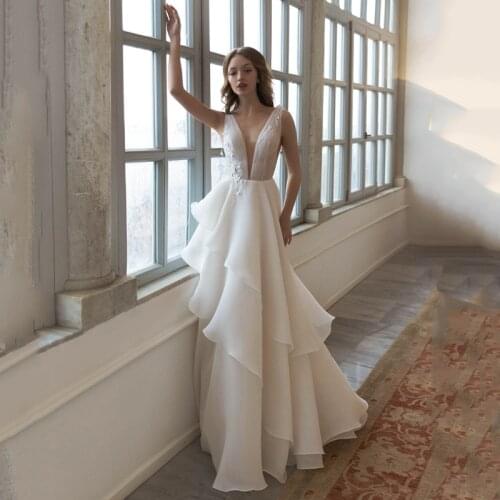 Eightree White Glitter Wedding Dresses Elegant Appliques Tassel Back Deep V-Neck Sleeveless Ruffle A-Line Bridal Gowns Plus Size