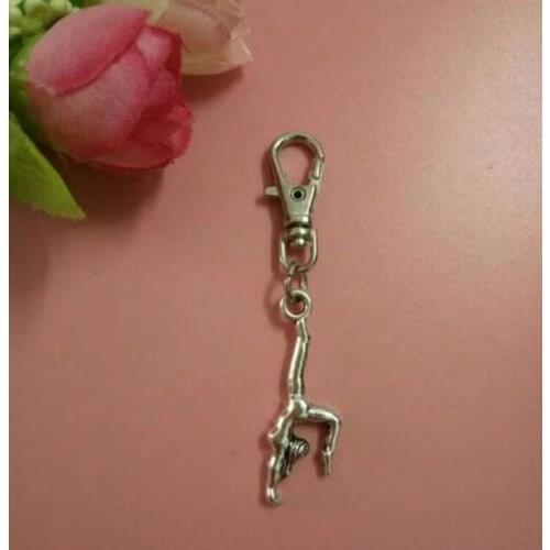 20pcs Beautiful Gymnast Girl New Fashion Vintage Pendant Charm Rotation Key Chain Fit Key Car DIY Handbag Gift Jewelry