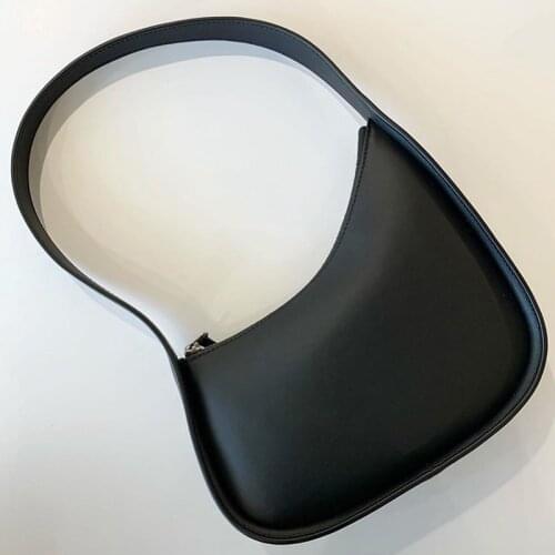 Niche design textured leather underarm bag new one-shoulder law stick bag Korean ins irregular hand-held half-month bag