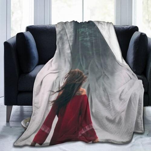 Woman in red dress facing the advent of horror disaster throwing blankets winter sheets happy nap, bed and sofa blanket