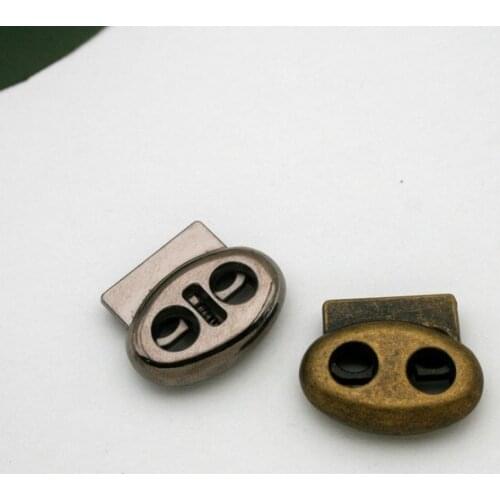 20 pcs / lot STP-008 oval metal alloy stoppers toggle cord locks Drawstring lock with two holes