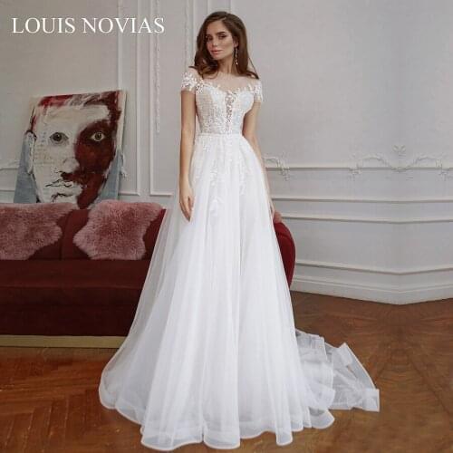 Louis Novias Sexy Boat Neck Beaded Elegant Lace Decal 2020 Twist Button Flower African Luxury Auditorium Romantic Wedding Dress