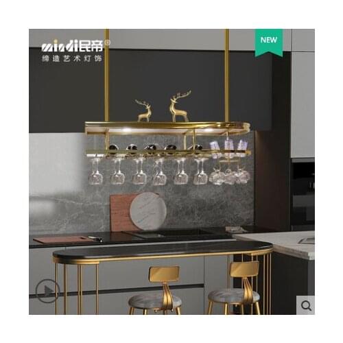 Red wine glass hangs upside down. Home bar chandelier wine stainless steel hanging wine rack. Island high wine glass rack in kit