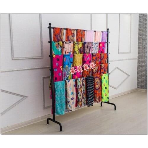 Wrought iron clothes rack, silk scarves. Scarf