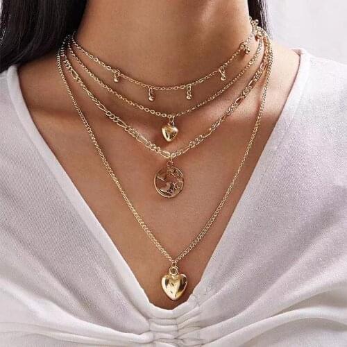 Retro fashion simple metal necklace ladies alloy hollow figure love ball pendant light luxury versatile multi-layered jewelry