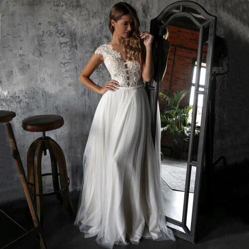 2020 New Long Lace Appliques Wedding Dresses A line V Neck See Through Button Back Bridal Gown Cap Sleeves
