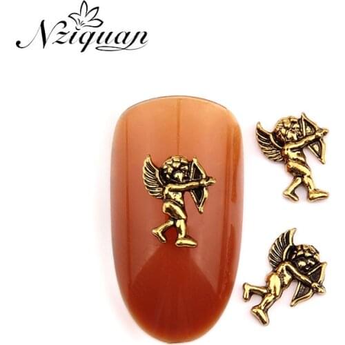 NZIQUAN 20pcs / box Little Angel 3D Shape Metal Bronze Nail Art Decoration Sticker Mosaic Accessories DIY Nail Art Supplies