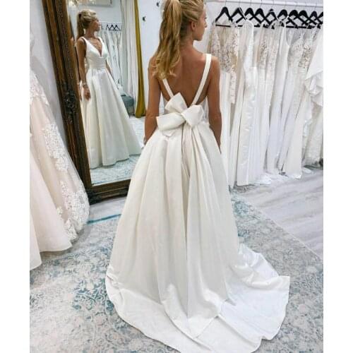 Sexy White A-Line Long Double V-Neck Satin Wedding Dresses with Pockets Floor Length Pleated Bridal Gowns with Bow for Women