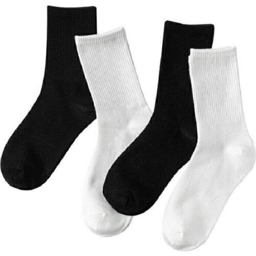 Socks female Korean version of solid color trend long tube Harajuku style socks male couple middle tube black high tube autumn a