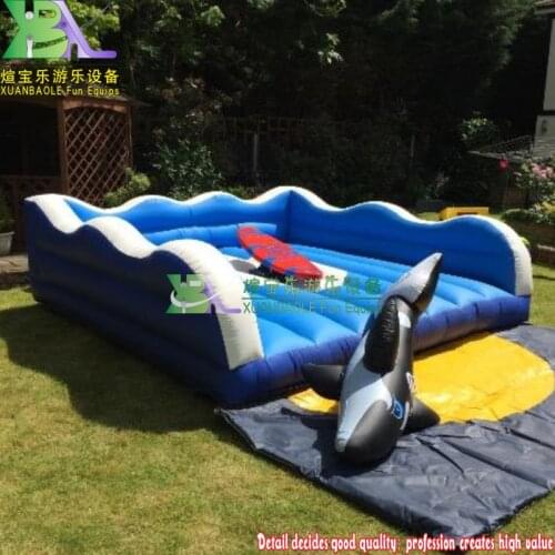 Children Birthday Party playing game inflatable rodeo surfboard ride