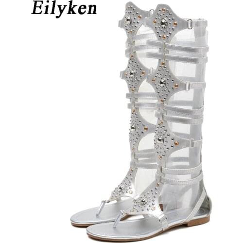 Eilyken 2021 New Golden Women Gladiator Roman Sandals PU Leather Open Toe Knee High Rivet Leisure Sandals Boots Flat
