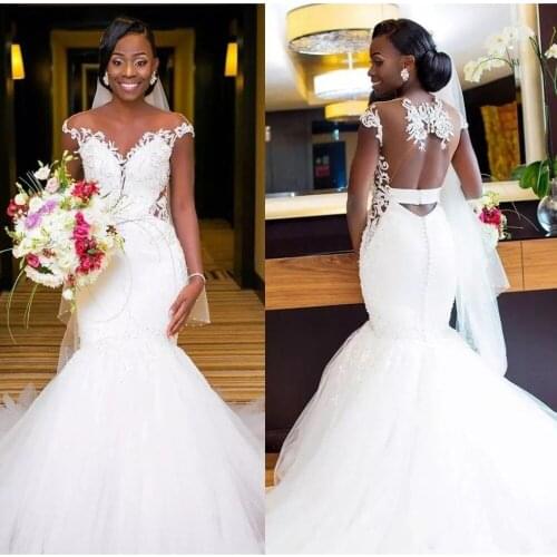 Sexy Illusion Back Africa Mermaid Wedding Dresses 2020 Pure White Cap Sleeve Embroidery Beading Lace Bride Wedding Dress