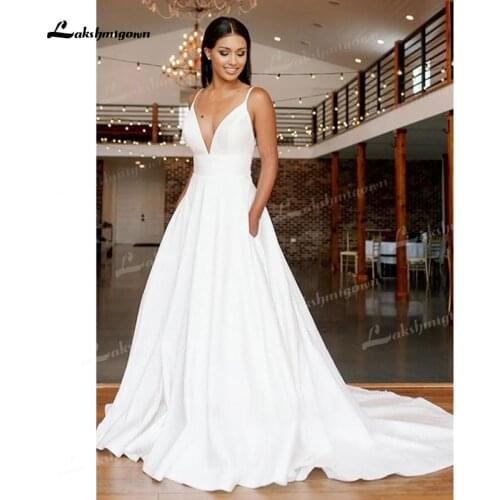 Charming A-Line Soft Satin Wedding Dresses Spaghetti Straps Sexy Deep V-Neck Lace Appliques Open Back Chapel Train Bride Gowns