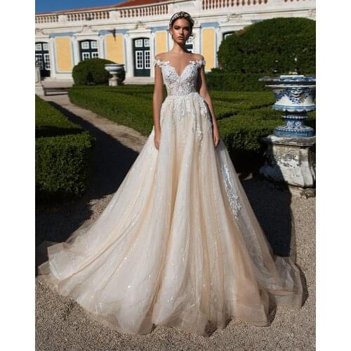 Trouwjurk O-Neck Wedding Dress Cap Sleeve Robe De Mariee Illusion Back Vintage Abiti Da Sposa Sequined Beading Bridal Gowns