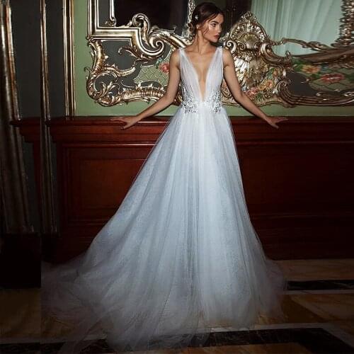 New Vintage Tulle Wedding Dresses Deep V-Neck Simple Lace Appliques Open Back A-Line Sleeveless Bridal Gowns Abito Da Sposa 2021