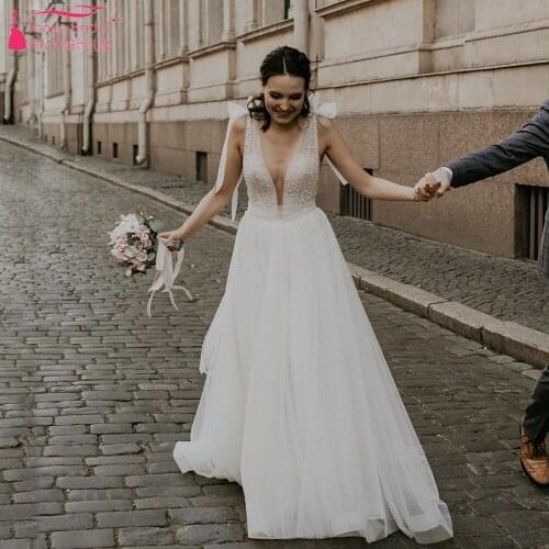 Deep V-Neck Wedding Dresses Backless Pearls Elegant Boho Beach Bridal Gowns ZW474