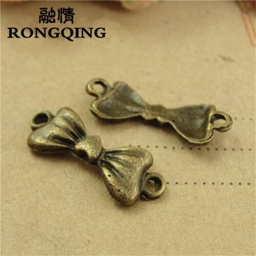 RONGQING 100pcs/lot 22*8MM Bow tie love Bronze Charms handmade Craft pendant making fit DIY for bracelet necklace