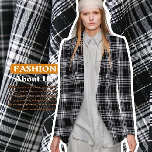 The new blue black European and American fashion new grid material shirt dress skirts fabrics such as cloth cloth