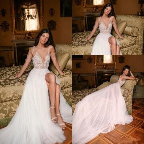 2021 Sexy Slit A Line Wedding Dresses Deep V-neck Crystal Applique Pearls Spaghetti Straps Sleeveless Backless Boho Bridal Gowns