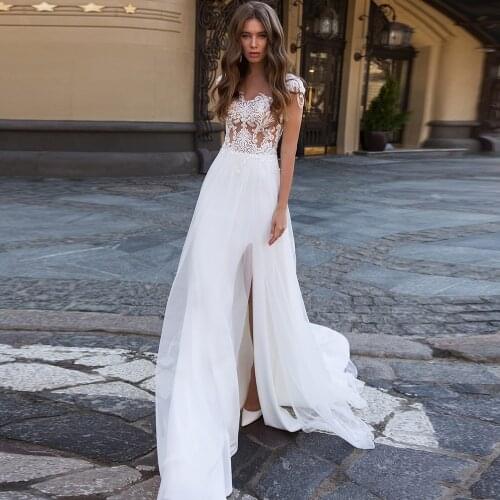 A-Line Chiffon Wedding Dresses 2021 Sheer O-Neck Cap Sleeve Lace Appliques Button Sweep Train Boho Bridal Gown Side Slit