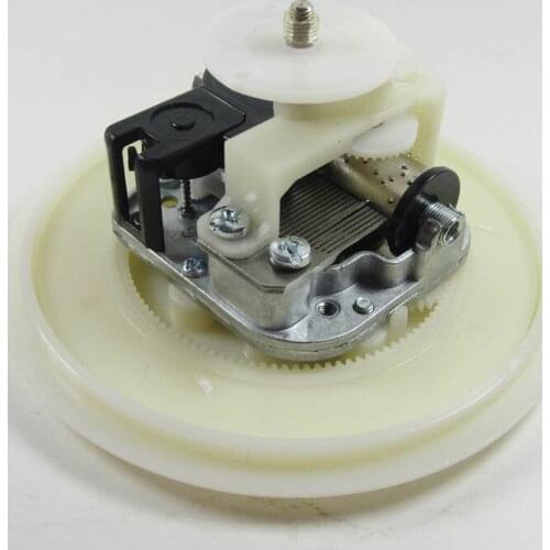 DIY music box mechanism with rotating plate and base in contrary direction