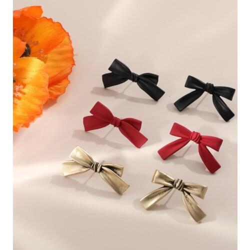 Autumn and winter Japanese retro cute red black ancient gold bow earrings DIY handmade jewelry earrings accessories materials
