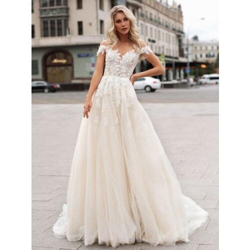 Champagne Lining Illusion Off The Shoulder Pearls Wedding Dress Floral Appliqued Beach 2021 Summer Short Sleeves Bridal Gown
