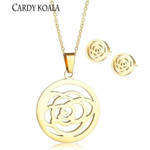Korean version of the round brand hollow flower titanium steel creative design pendant necklace earring set gold-plated children